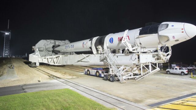 In this Monday, Nov. 9, 2020 photo provided by NASA, a SpaceX Falcon 9 rocket and Crew Dragon capsule is rolled out of the horizontal integration facility at Launch Complex 39A, as preparations continue for a crewed mission at NASA's Kennedy Space Center in Florida. NASA astronauts Mike Hopkins, Victor Glover, and Shannon Walker, and astronaut Soichi Noguchi of the Japan Aerospace Exploration Agency (JAXA) are scheduled to launch on Saturday, Nov. 14. (Joel Kowsky/NASA via AP)
